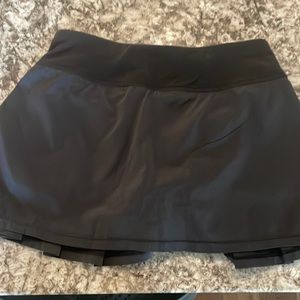 Ivivva (Lululemon’s children’s brand) black tennis skirt with built in shorts.